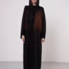 Brown zebra-print abaya with snap closings.