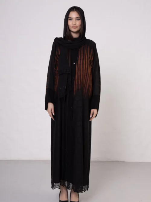 Brown zebra-print abaya with snap closings.