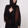 Brown zebra-print abaya with snap closings.