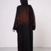 Brown zebra-print abaya with snap closings.